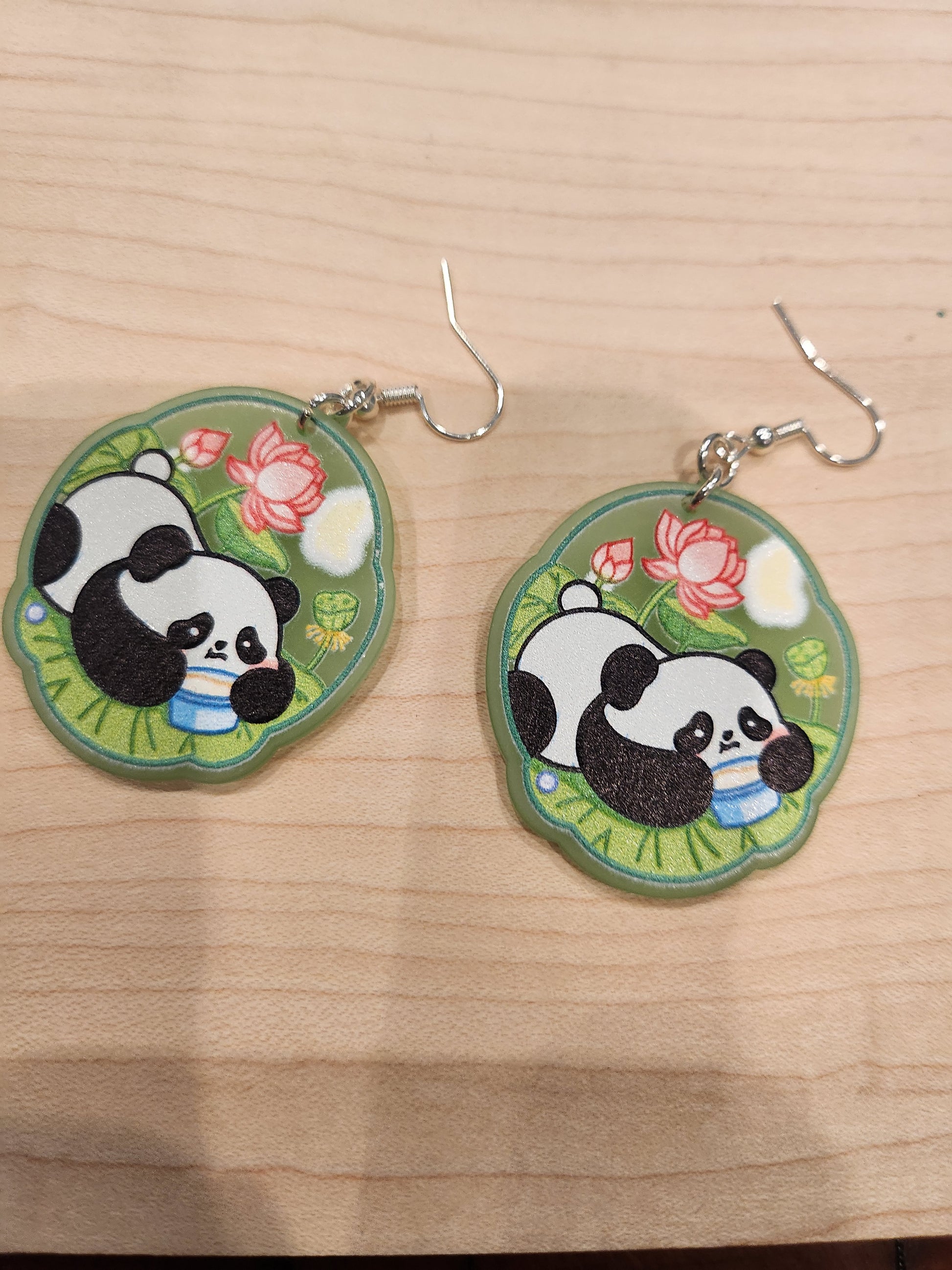 Item: #1004. Green #2 panda bear eating pudding. 